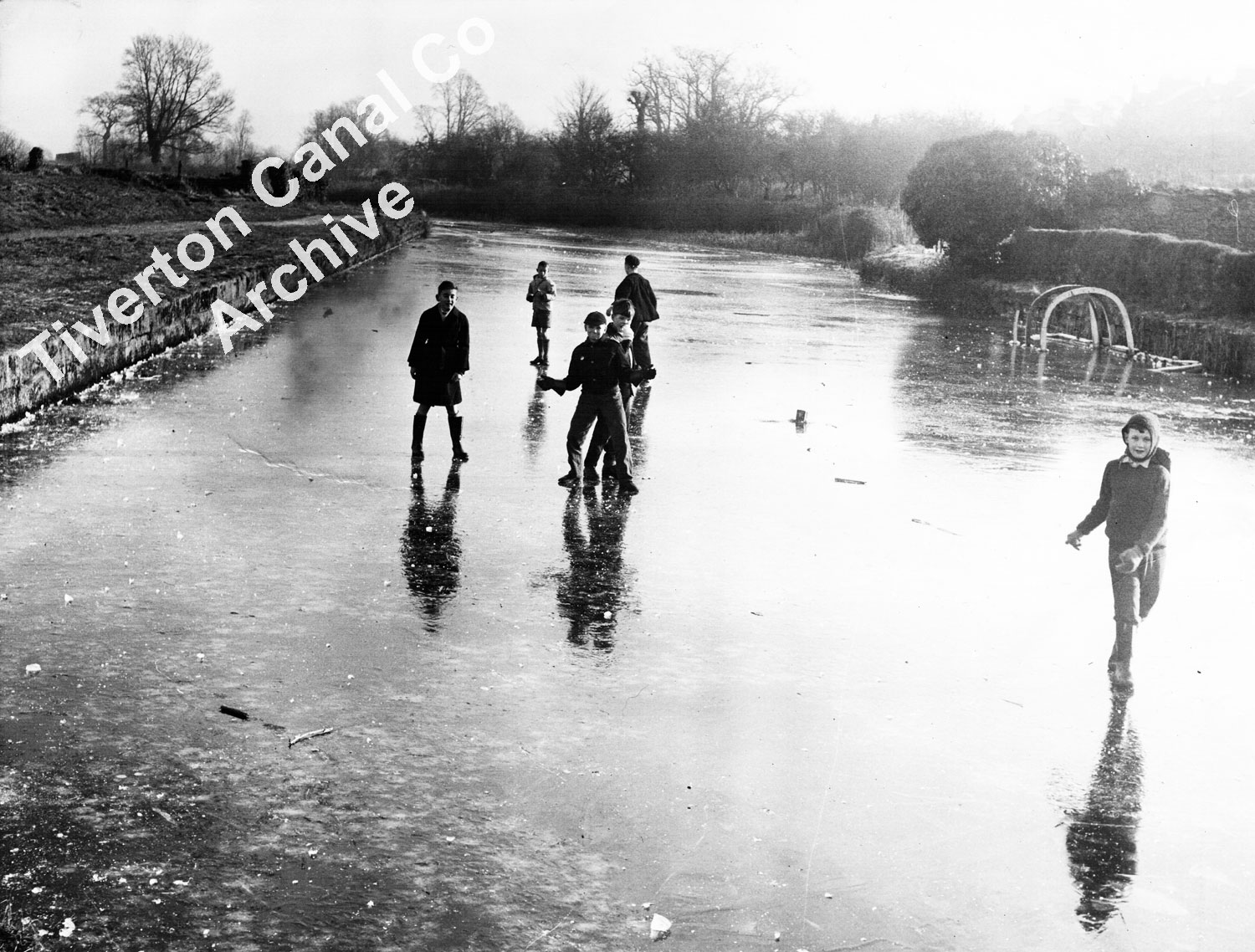 Children skating on the ice in the Tiverton basin in 1963